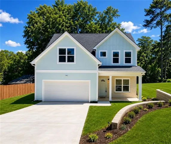 Virtually enhanced to help visualize the property’s landscaping potential and elevated curb appeal.