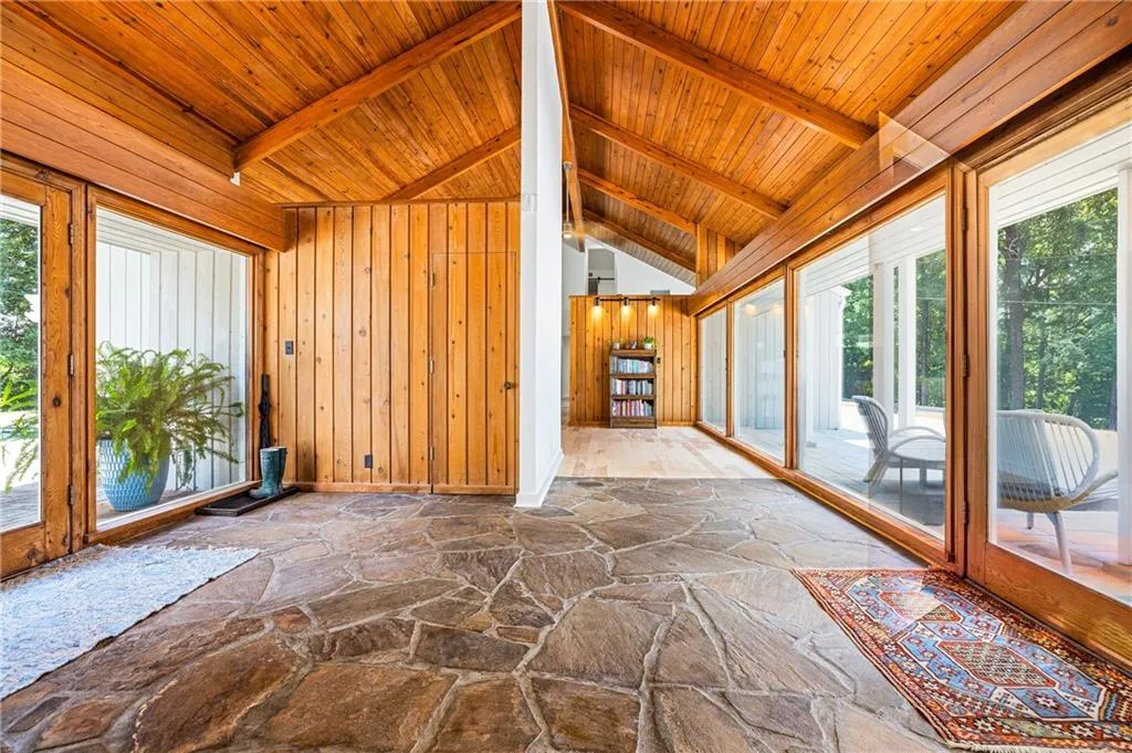 Looking at the photo, Front Entrance to the right and Back Door (one of many) to the left