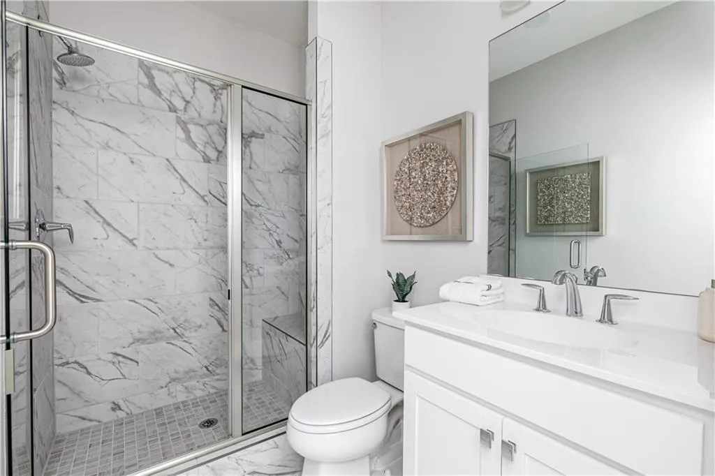 Primary bathroom! Tiled walk-in shower! Photos of previous Blanche model!