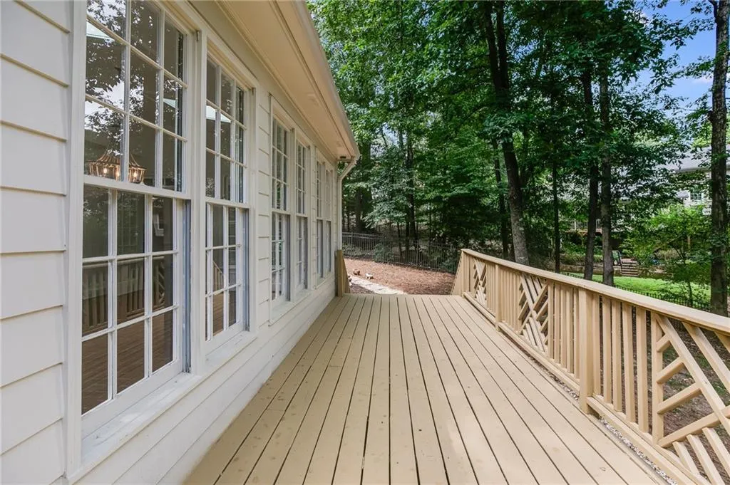 Deck with view of scattered trees