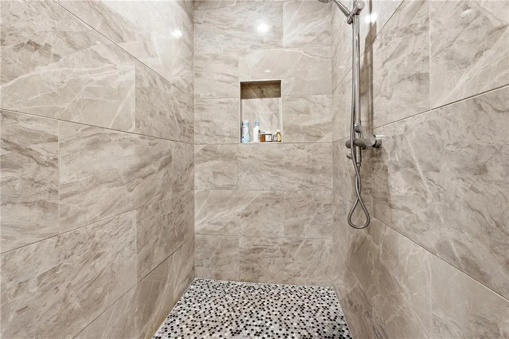 Bathroom with a tile shower