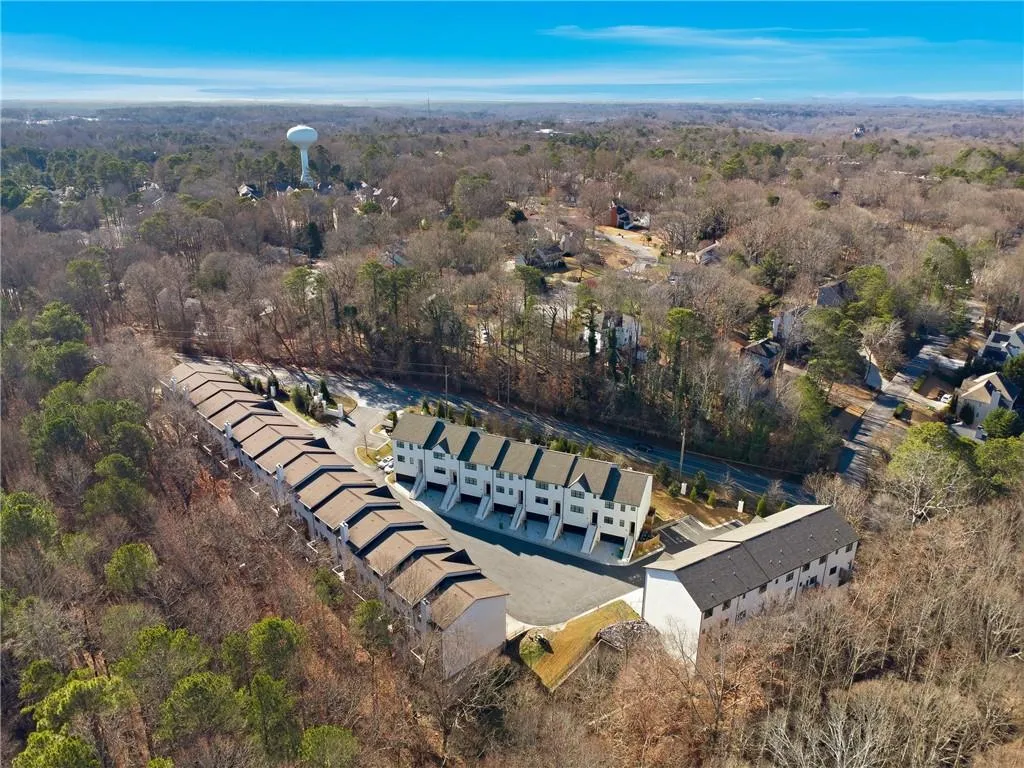 Aerial view of property's location with a forest