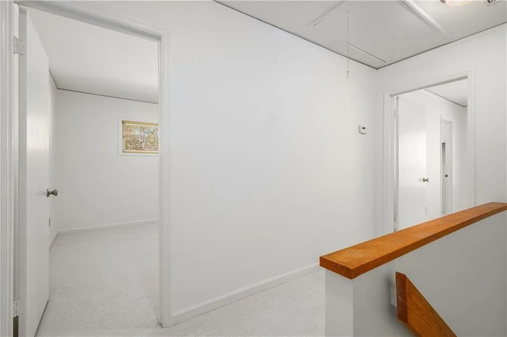 25 Forrest Place~ Upstairs landing. Not pictured:behind attic access which has which has walkable areas and tons of storage!