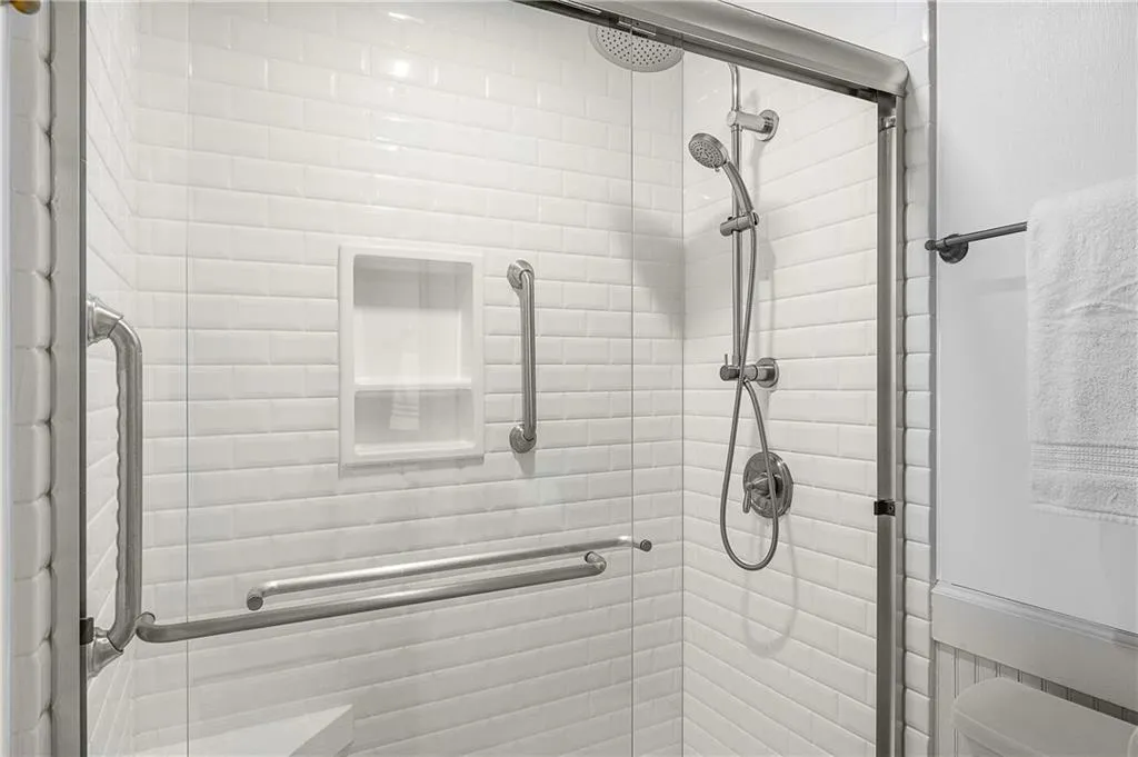 25 Forrest Place~ The Primary Bathroom was renovated ~ 2010 and included installing a brand new shower fixtures, ship lap, a new vanity and tile floor.