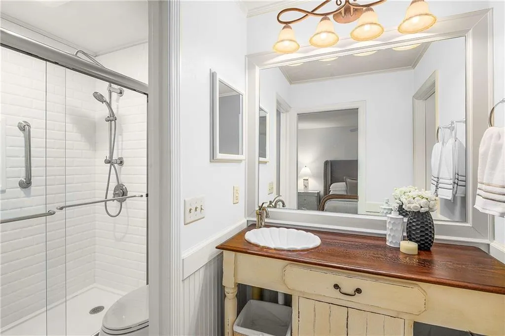 25 Forrest Place~ Updated Primary Bathroom features floor to ceiling tiled shower, stylish vanity and opens up to the Primary closet.