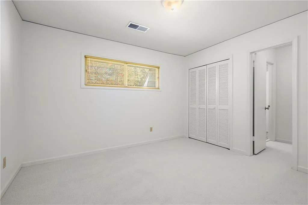 25 Forrest Place~ Secondary Bedroom #1- Spacious, light and bright with a walk in closet and connects to a renovated Jack and Jill bathroom.