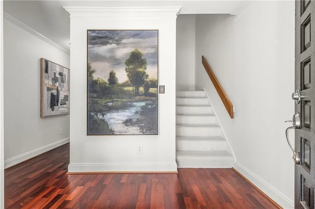 25 Forrest Place~ Gleaming hardwood floors, freshly painted throughout, refreshed kitchen, primary on the main - what an offering for $450,000 and in the heart of Sandy Springs!