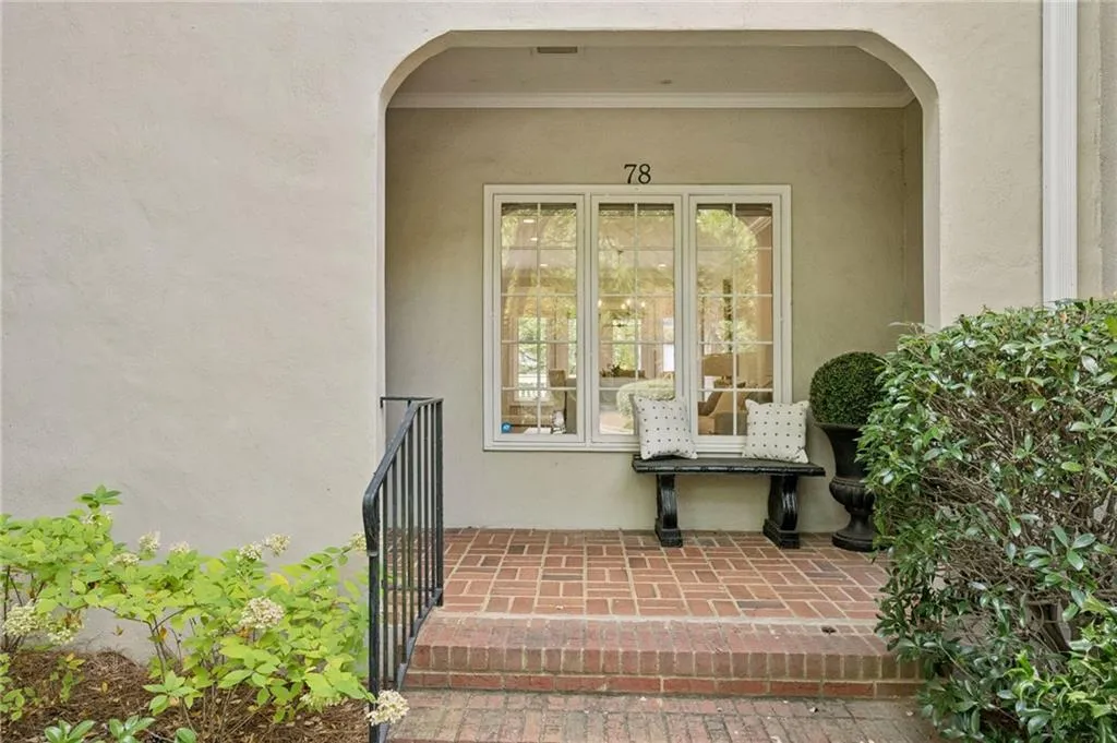Doorway to property with stucco siding