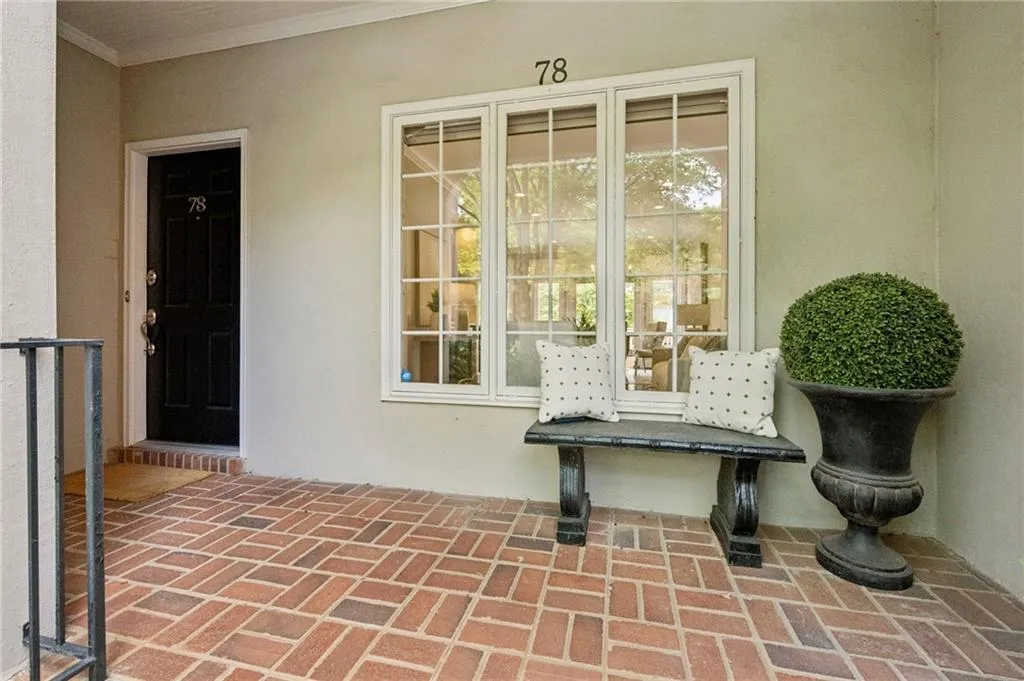 View of exterior entry with stucco siding