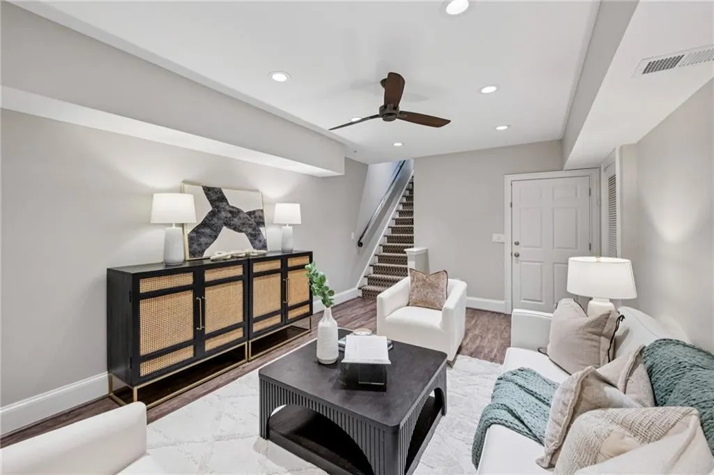 Living room featuring stairway, recessed lighting, a ceiling fan, and wood finished floors