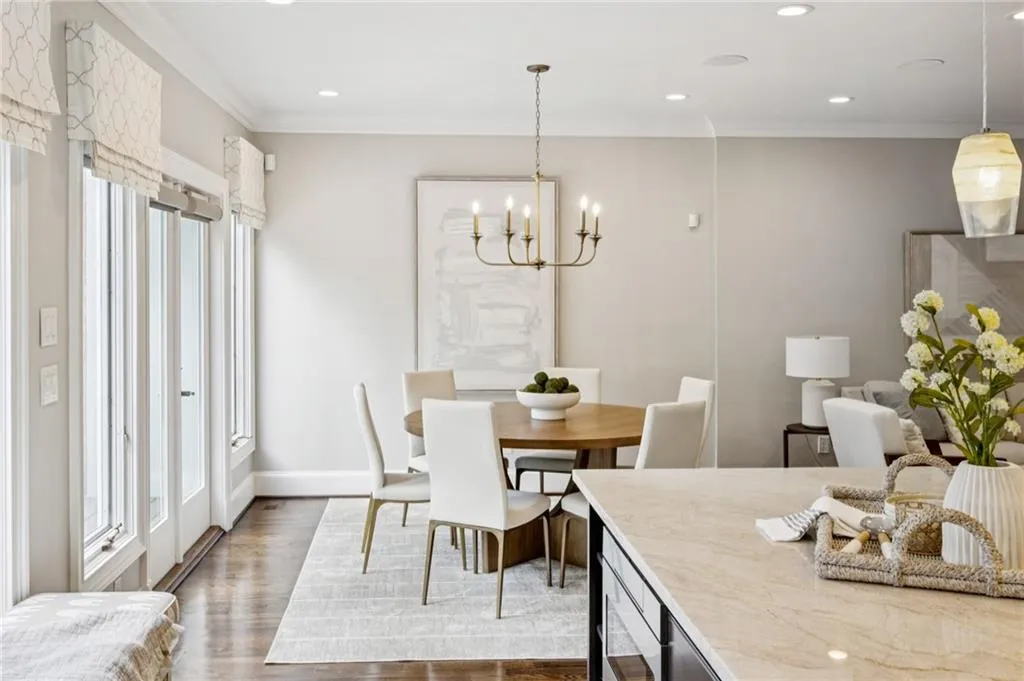 Dining space featuring crown molding, dark wood-type flooring, recessed lighting, and a chandelier