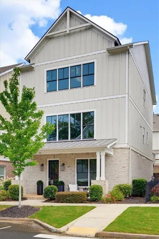 Contemporary vertical siding and brick exterior