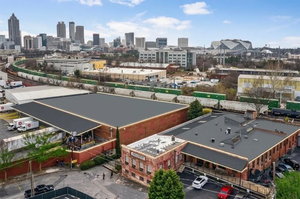 Expansive commercial property featuring multiple structures with brick facades and flat roofs