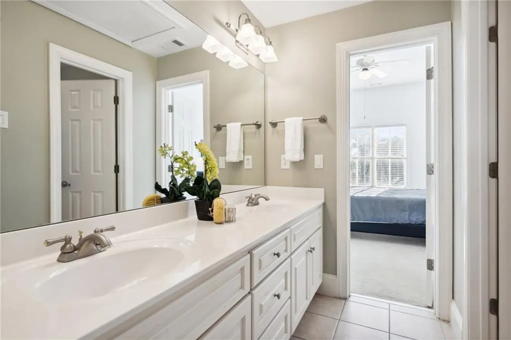 Shared Bathroom with double vanity separate shower/tub