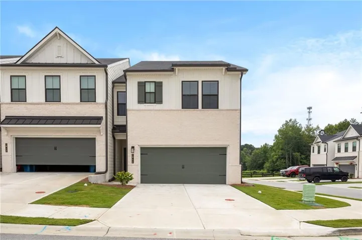 Modern exterior with brick facade and vertical white siding