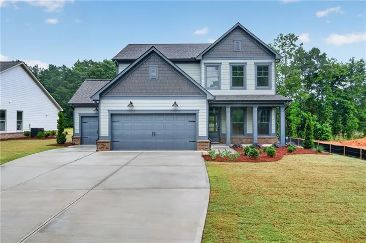 Contemporary two-story exterior with siding and shingle accents