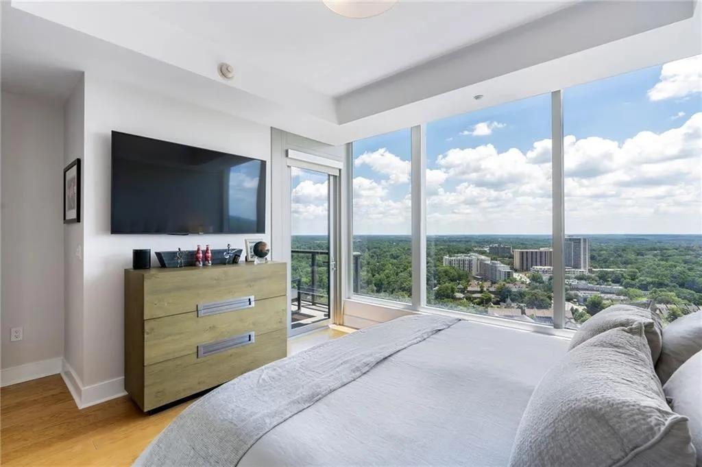 Bedroom featuring light wood-type flooring and access to exterior