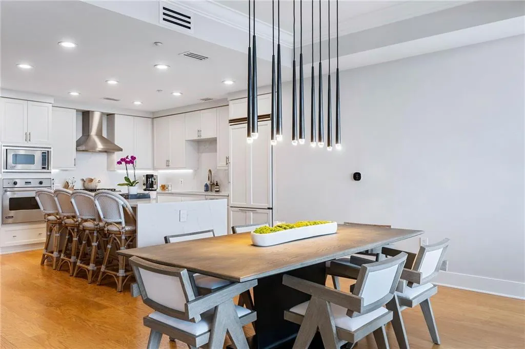 Dining area featuring light wood-type flooring and recessed lighting