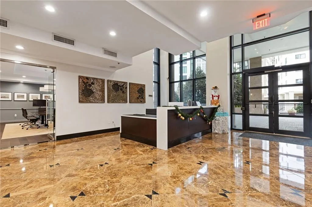 Welcome area featuring french doors, expansive windows, and recessed lighting
