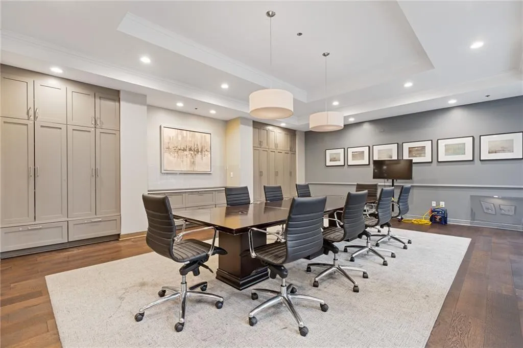 Office space featuring recessed lighting and ornamental molding
