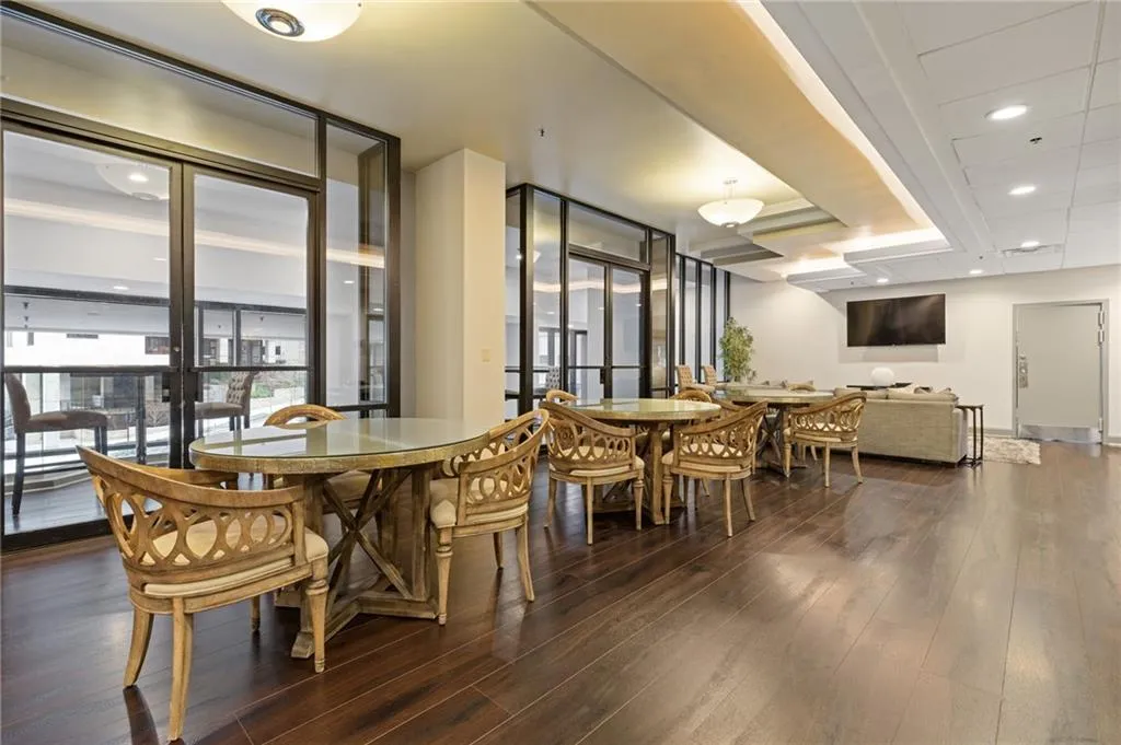 Dining space featuring recessed lighting and dark wood-style flooring