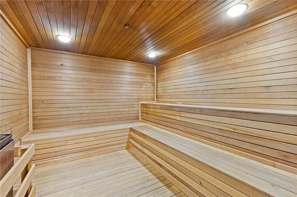 Relaxing sauna / steam room featuring wooden walls and wooden ceiling