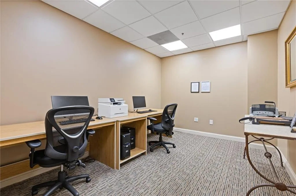 Office featuring a drop ceiling