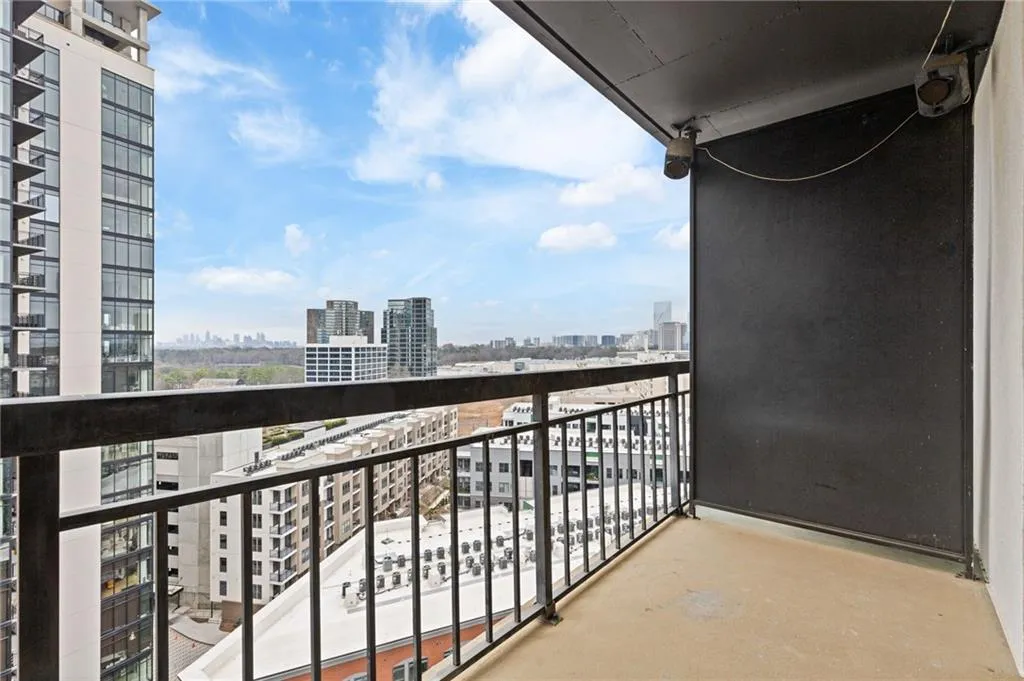 Balcony featuring a view of city