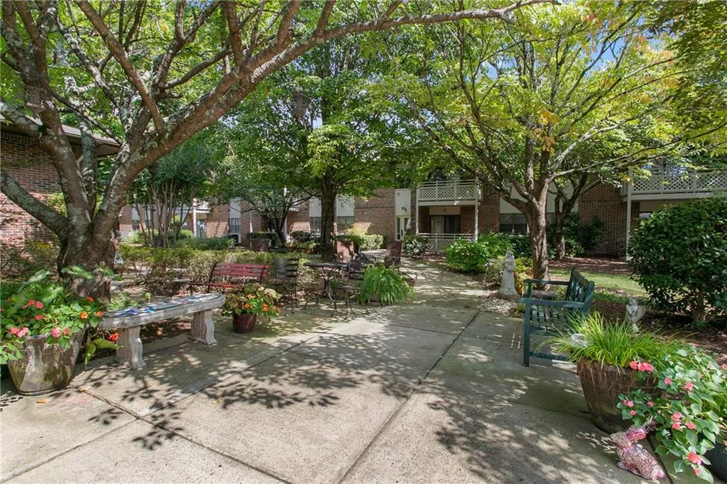 View of home's community with a patio area