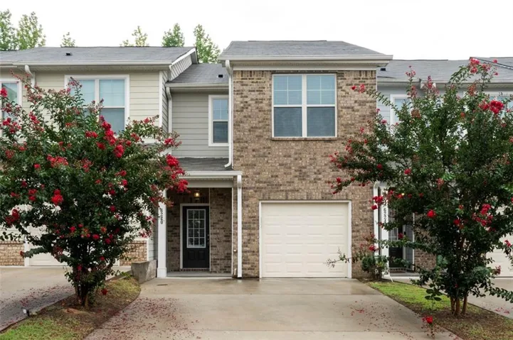 Brick and siding exterior with a single-car garage