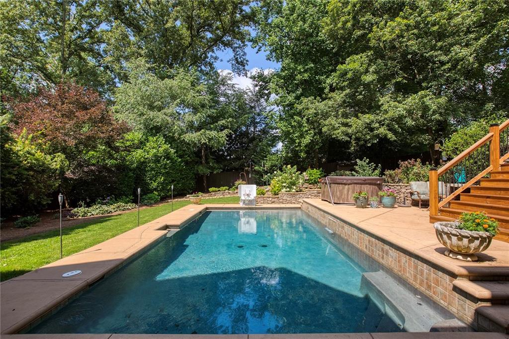 Difficult to see here, but beyond the pool is a large space for playset, pitchbacks, etc.