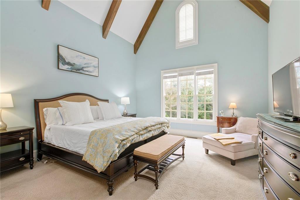 Beautiful master suite offers separate His and Hers closets, separate toilet and bidet room, frameless shower, and soaking tub.