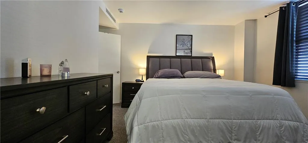 Bedroom with light carpet Bedroom with light carpet