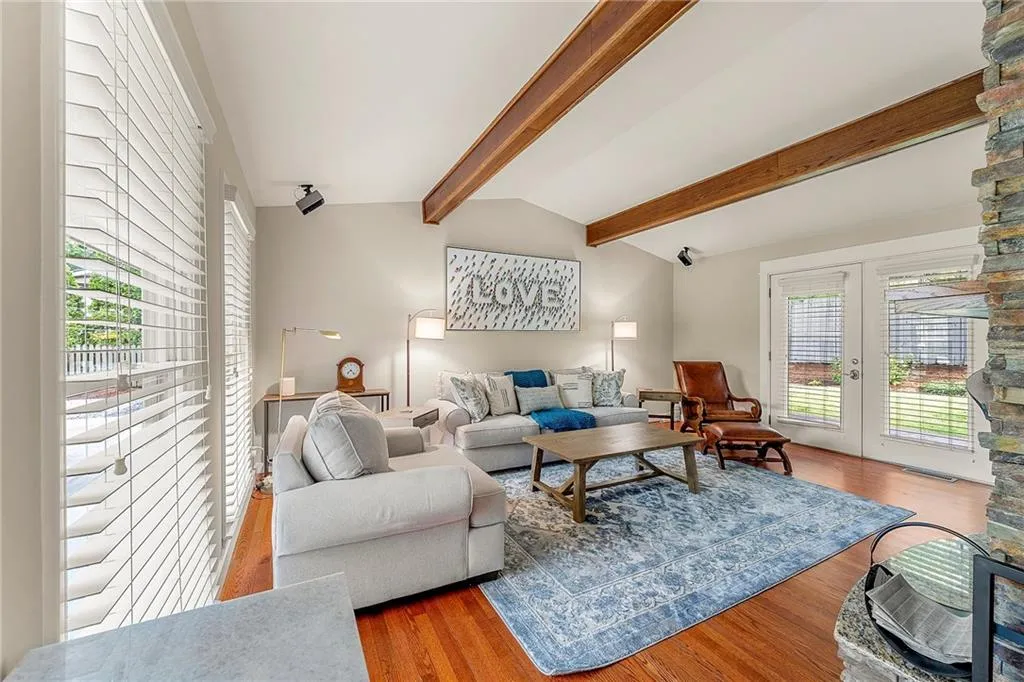 Living room featuring wood finished floors and a fireplace