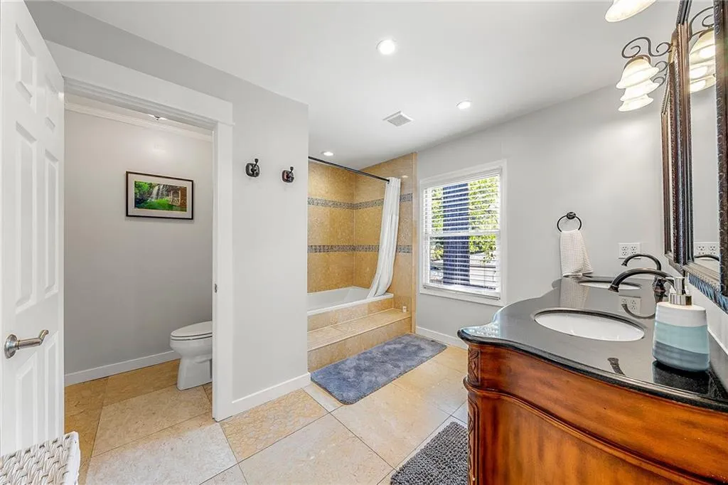 Full bathroom with tiled shower / bath, vanity, recessed lighting, and tile patterned floors
