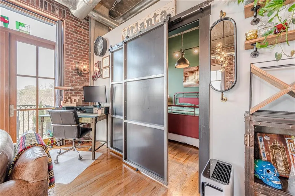 Exposed brick wall with industrial-style sconce lighting