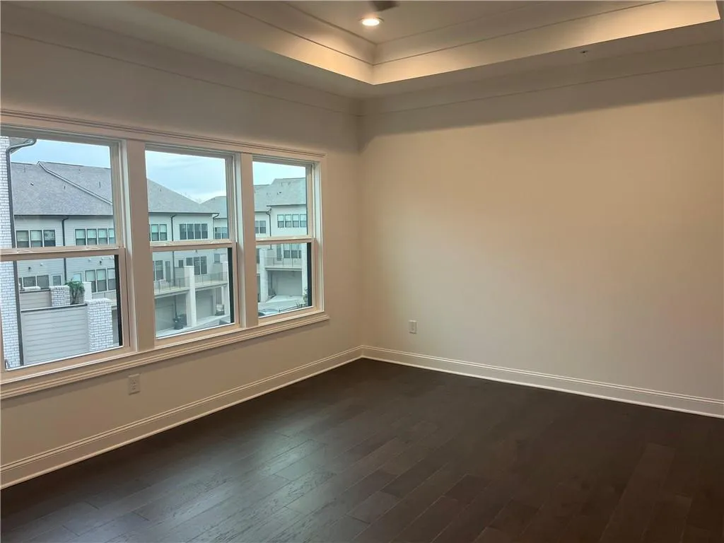 Don't miss the spacious primary bedroom with hardwood floors, trey ceiling and can lighting.