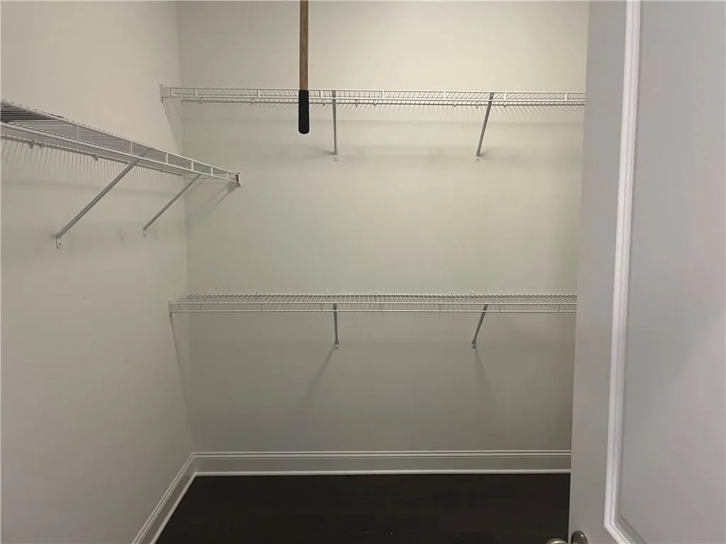 The Primary walk in closet has great space with hardwood floors.