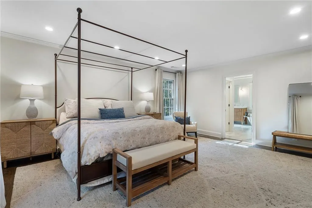 Primary bedroom wing is privately situated upstairs.