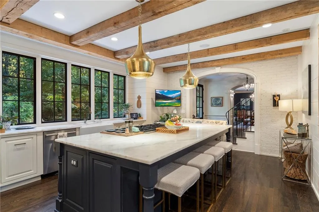 Renovated kitchen with larger windows, marble countertops, beamed ceilings and opened up to breakfast room.