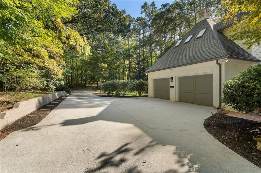 Oversized garage with EV hookup and new garage doors.