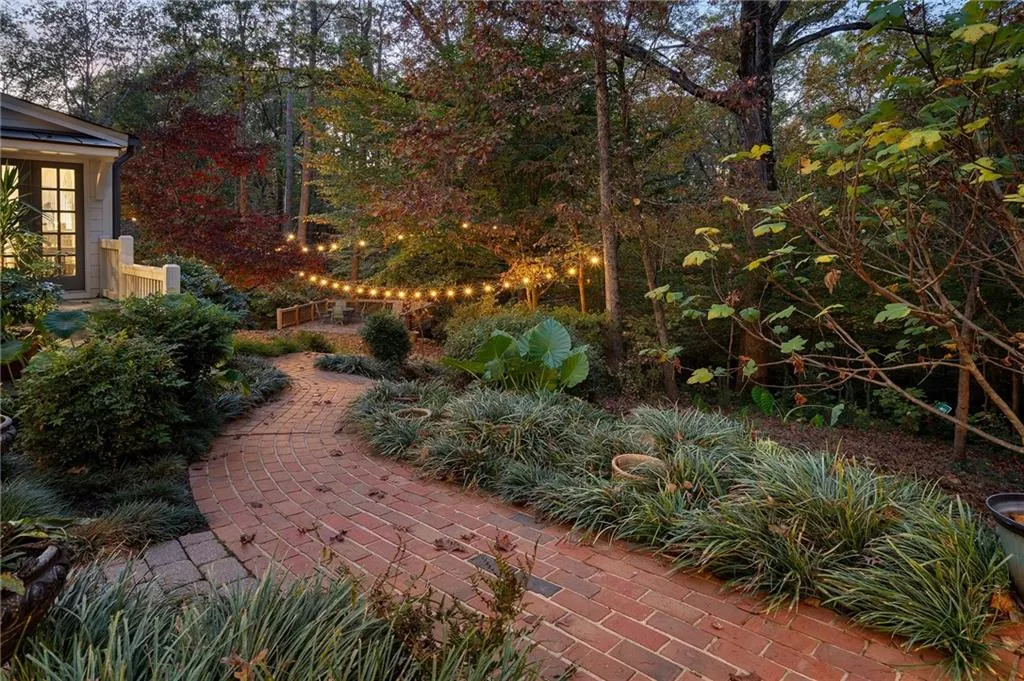 Walkway around the property.  Fenced in back.