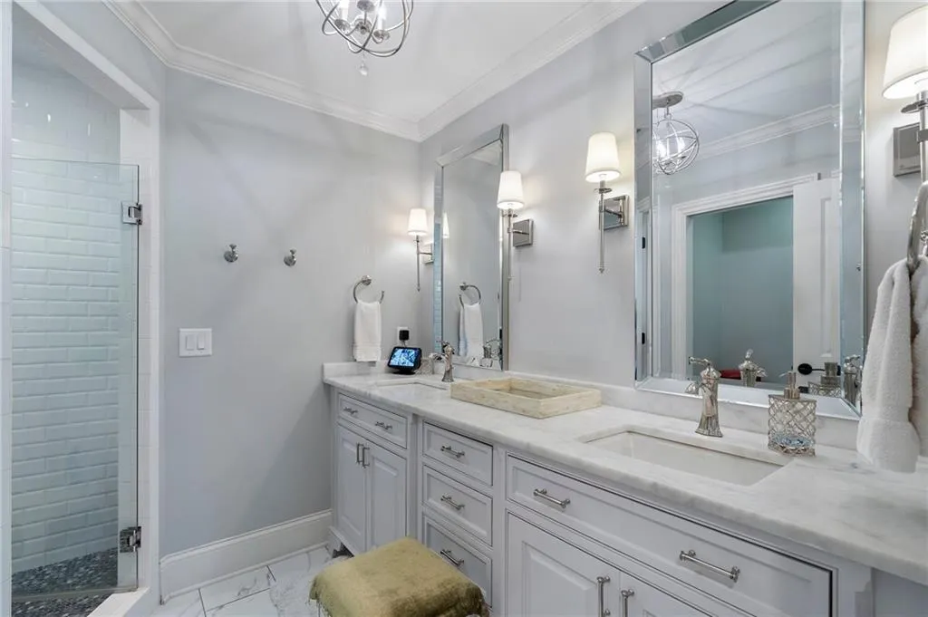 Guest bath in marble, double sinks.