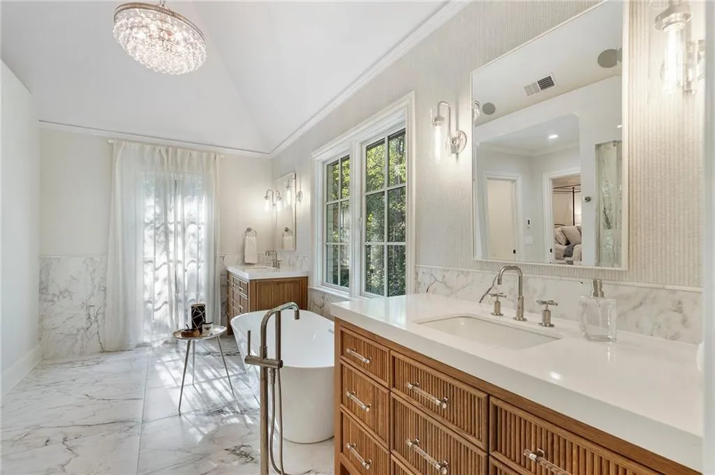 New primary bath with heated floors, double shower.