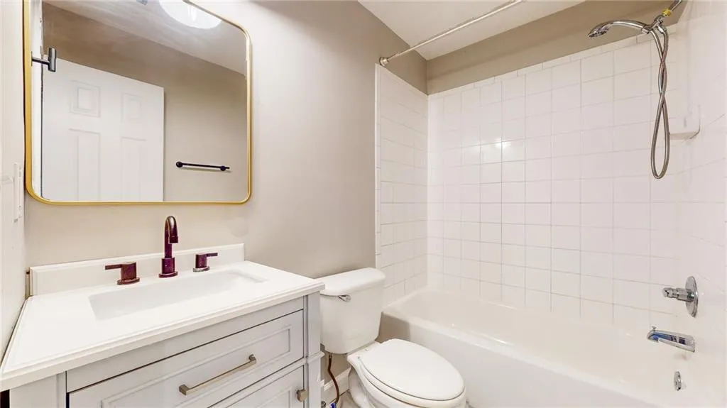 Full bath with vanity and bathtub / shower combination