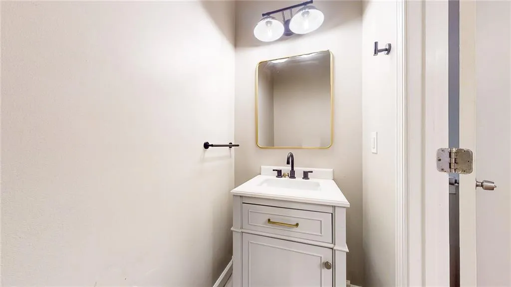 Half bathroom featuring vanity