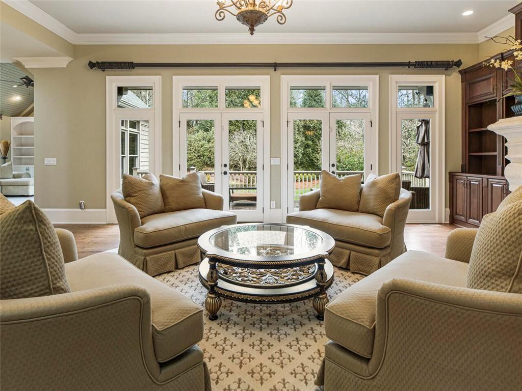 Formal living area with French doors leading to deck for easy entertaining