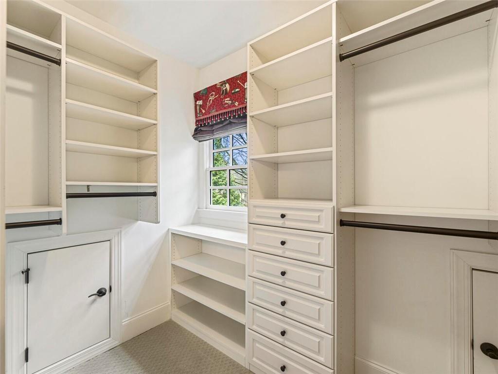 One of 4 custom walk in closets on upper level