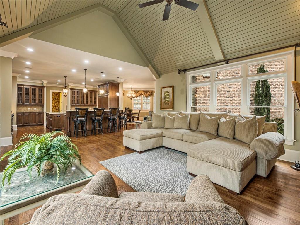 Great room with beautiful beamed ceiling open to kitchen