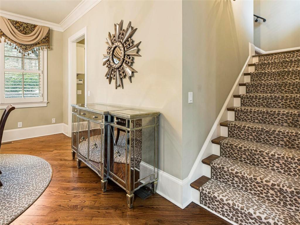 Stairs off of the breakfast area leading to private au pair/in law suite